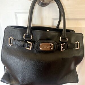 Michael Kors black leather bag with silver hardware.
